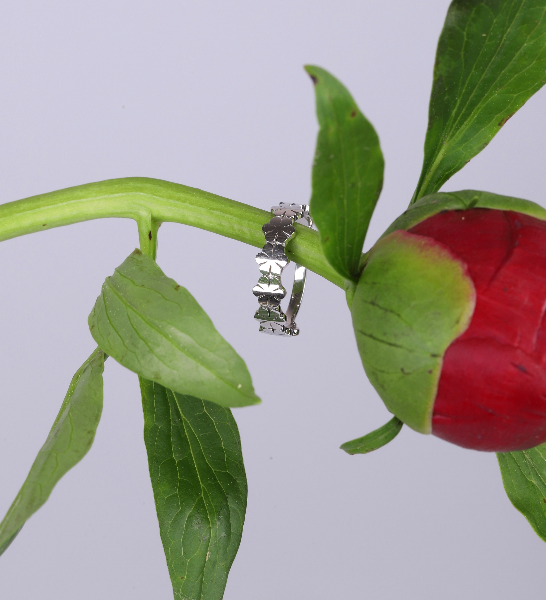 Lattice floral band ring styled on a flower stem