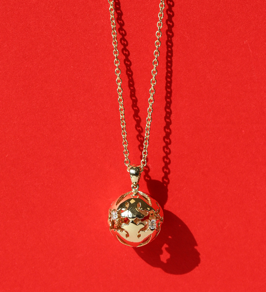 Jangseok orb pendant necklace on red background